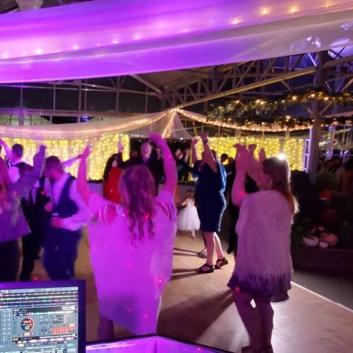 Engagement party dancefloor with guests dancing and celebrating. Mobile DJ.