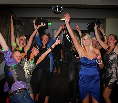 Colorful 30th birthday dancefloor with guests enjoying the celebration. DJ Events and Parties.