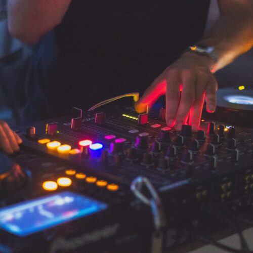 DJ Controlling Sound Mixer. Experienced and professional DJ hire in Melbourne.