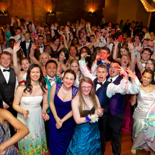 A school formal event with 200 well-dressed students, capturing the elegance and camaraderie of the evening.